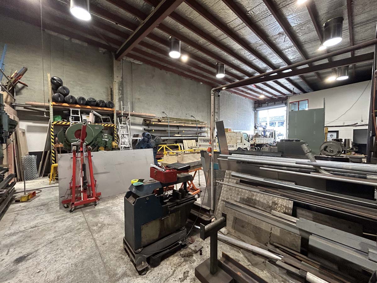 Industrial workshop with metalworking tools and equipment at 47A Victoria Street.