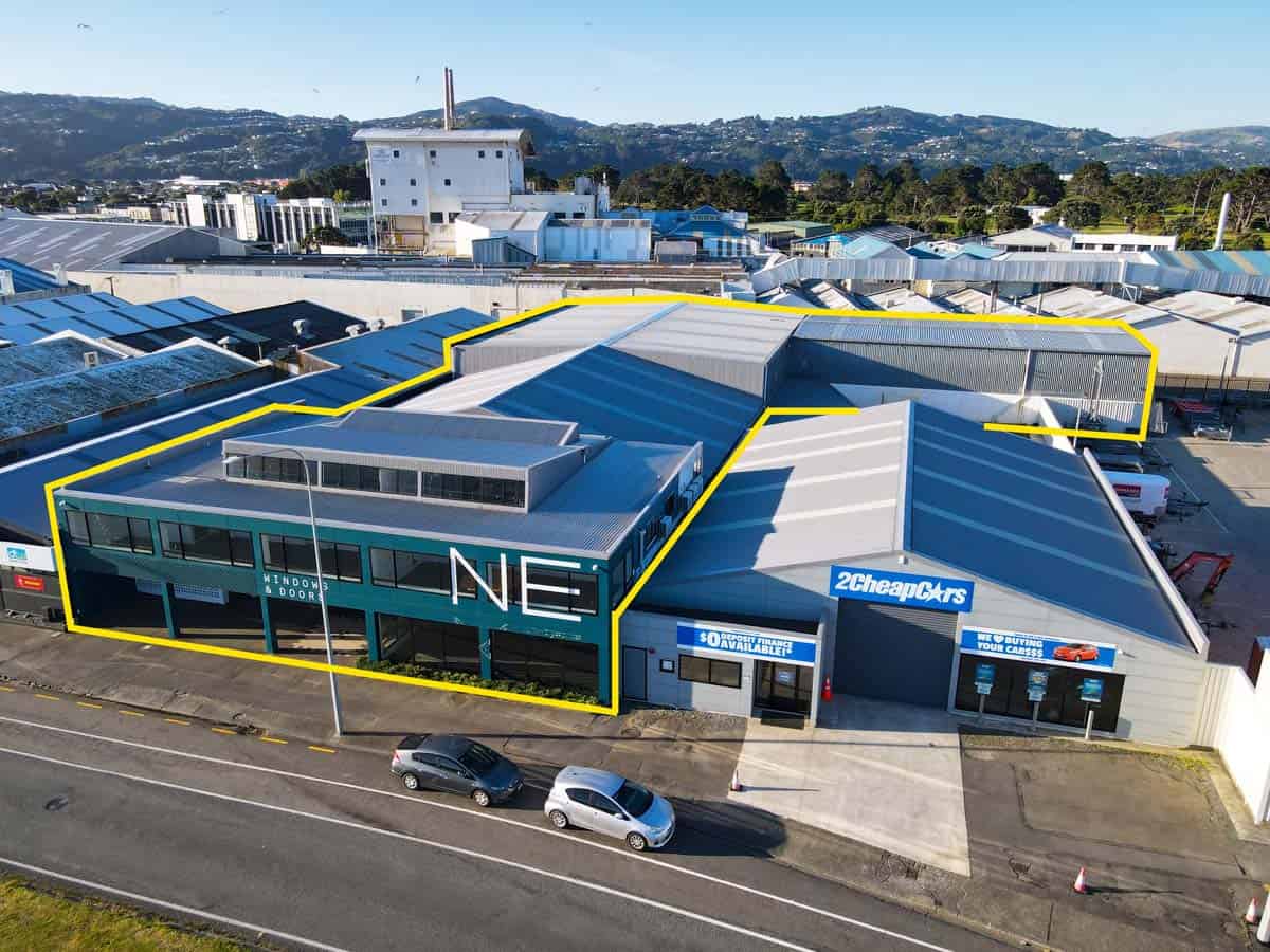 Modern industrial warehouse at 69 Waione Street, Auckland, with surrounding commercial buildings.