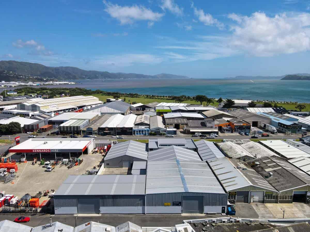 Aerial view of White Lion industrial buildings with waterfront in the background.