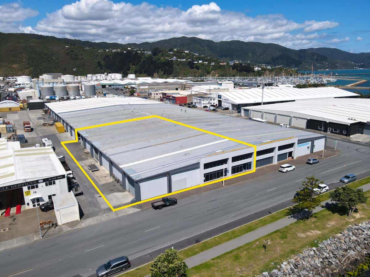 Aerial view of White Lion industrial warehouse at 77 Port Road, with surrounding buildings and mount.