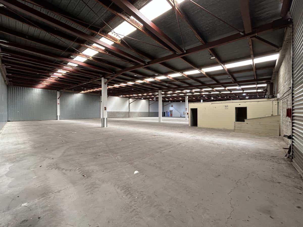 Spacious warehouse interior at 77 Port Road with high ceilings and open floor space.