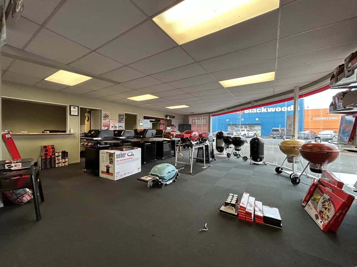 Interior view of White Lion showroom with BBQs and outdoor equipment at 86 Gill Street.