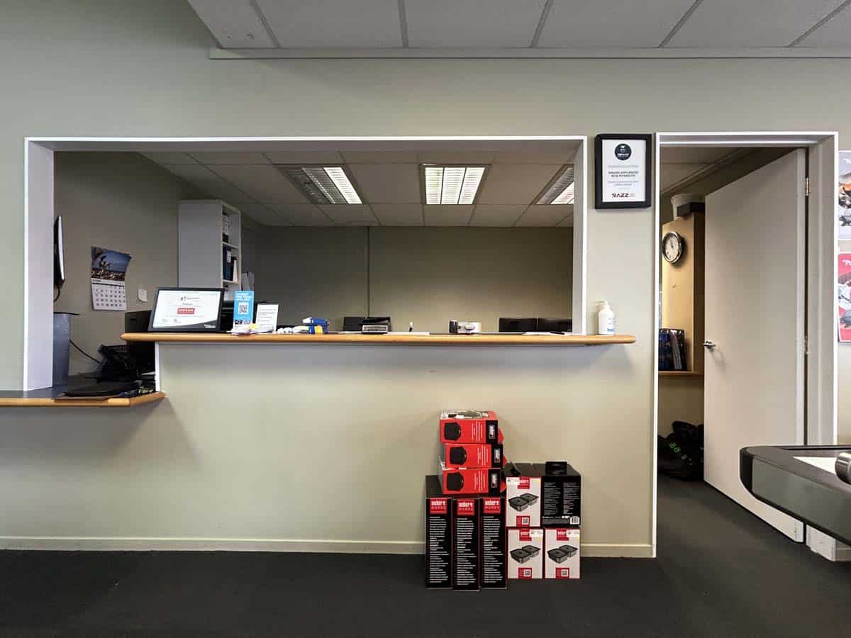 Modern White Lion office reception with product displays and signage.