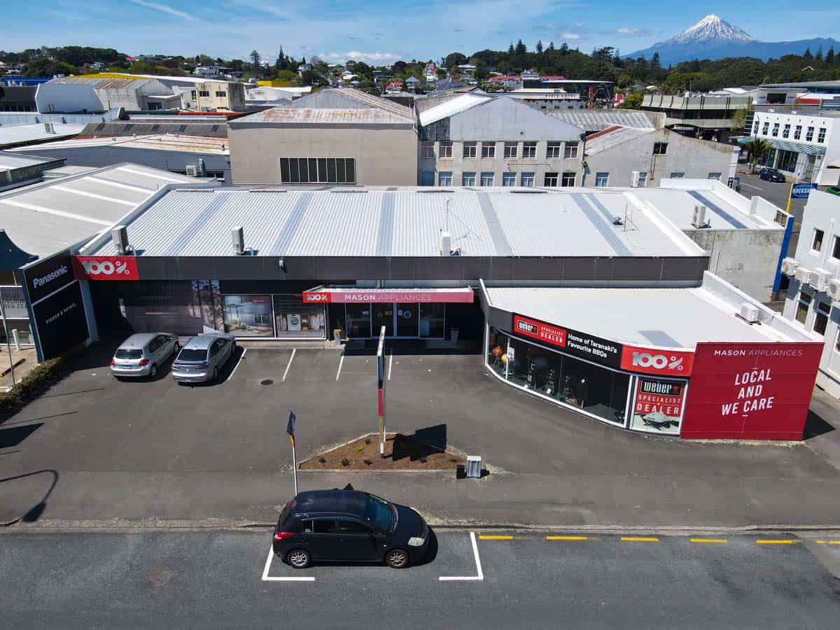 White Lion store at 86 Gill Street with parking and Mount Ruapehu in background.