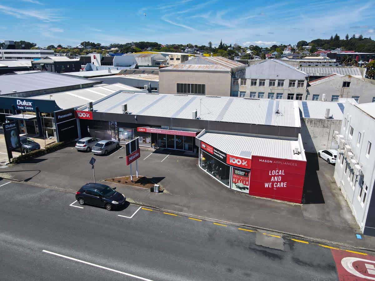 Aerial view of White Lion retail and office complex at 86 Gill Street, featuring modern storefronts.
