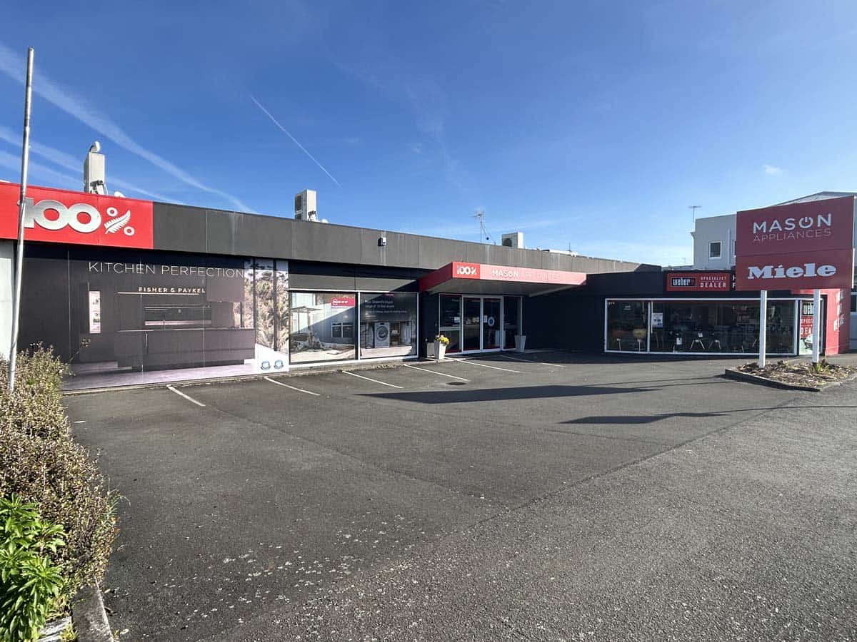 Exterior view of White Lion store at 86 Gill Street, Auckland, showcasing retail signage and storefr.