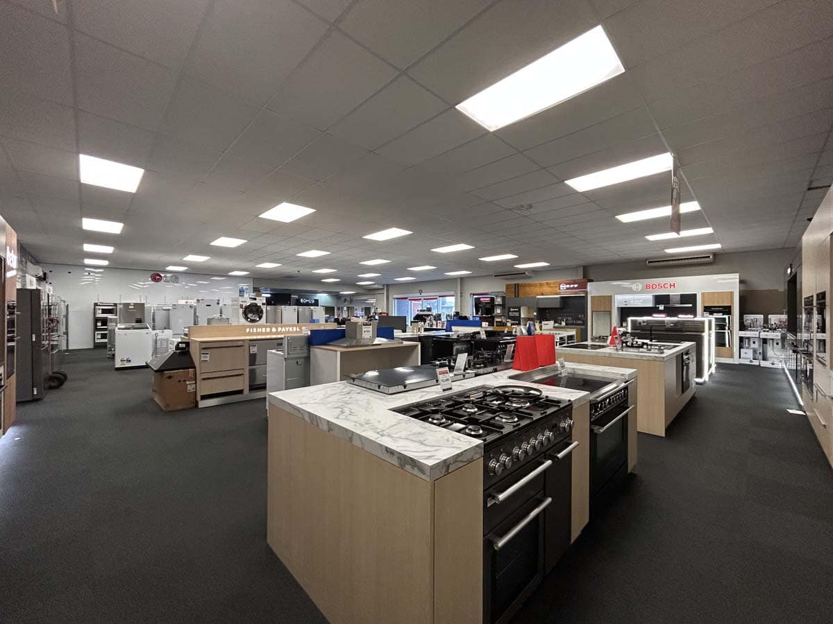 Modern appliance showroom at White Lion, 86 Gill Street, featuring kitchen appliances and displays.