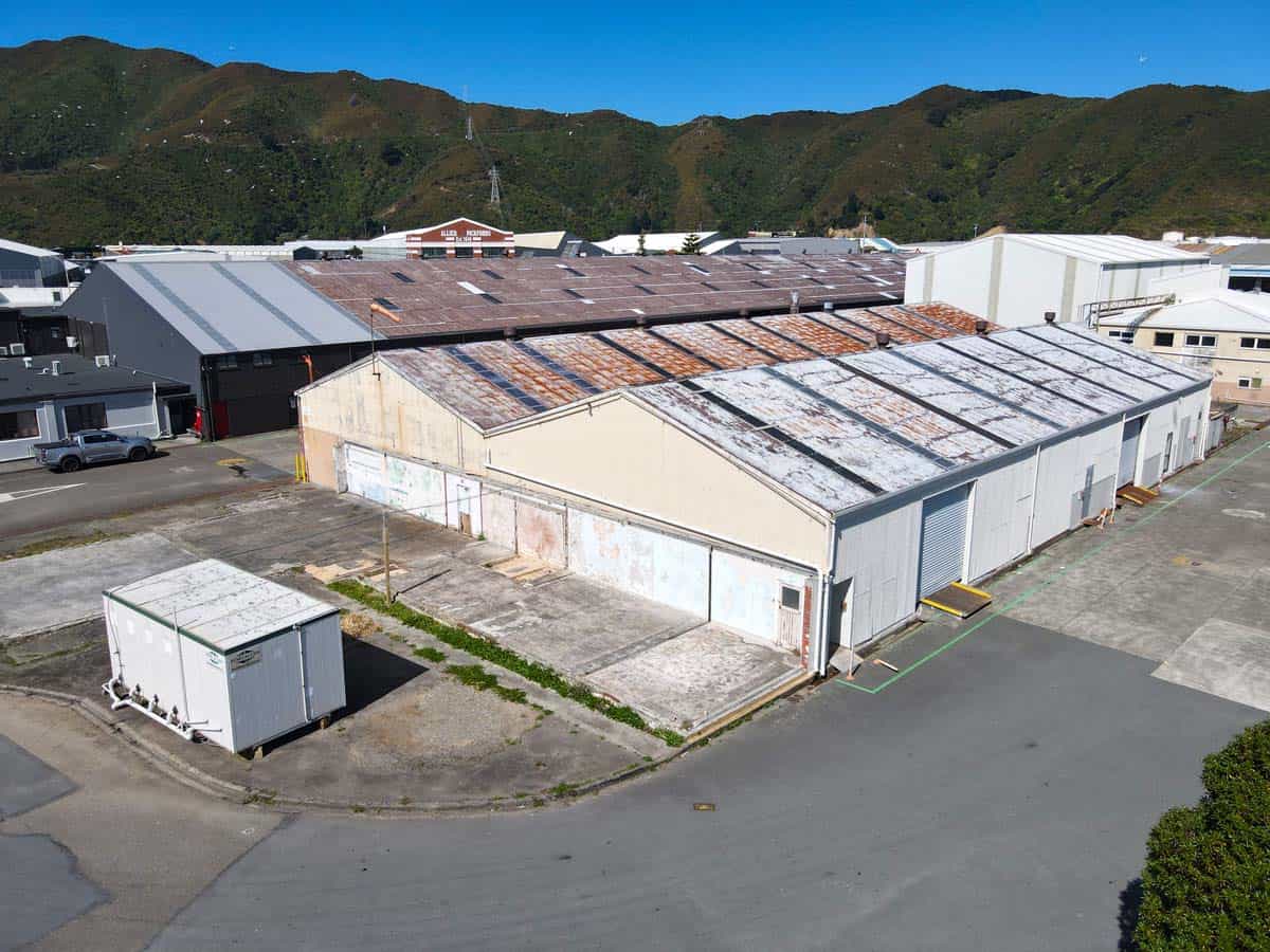 Aerial view of White Lion industrial warehouse at 42 Seaview Road with surrounding buildings and hil.