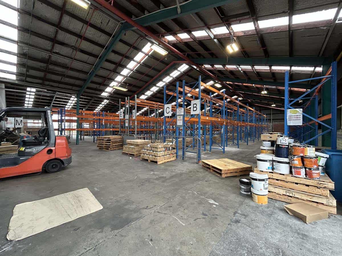 Industrial warehouse storage with shelving, pallets, and forklift at 42 Seaview Road.