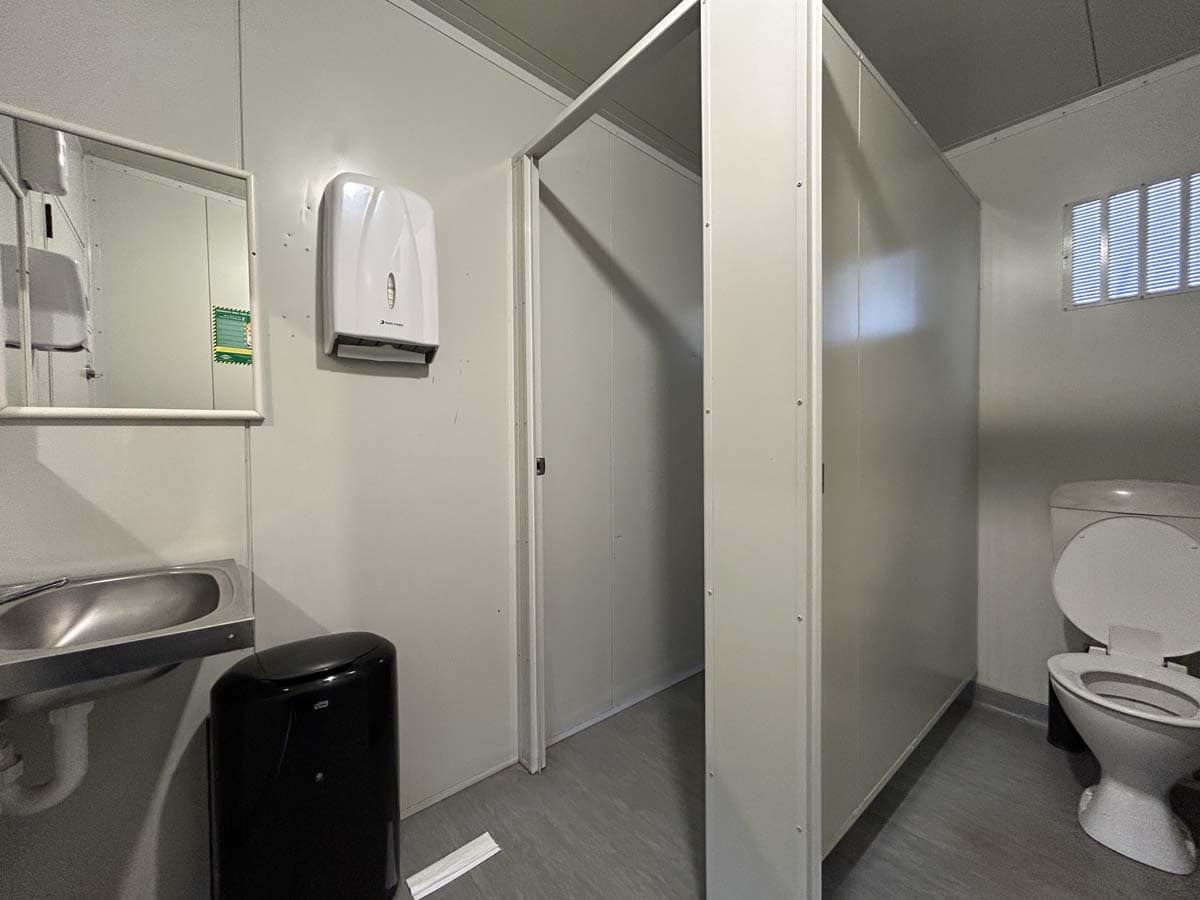 Clean public restroom with sink, soap dispenser, and toilet at 42 Seaview Road.
