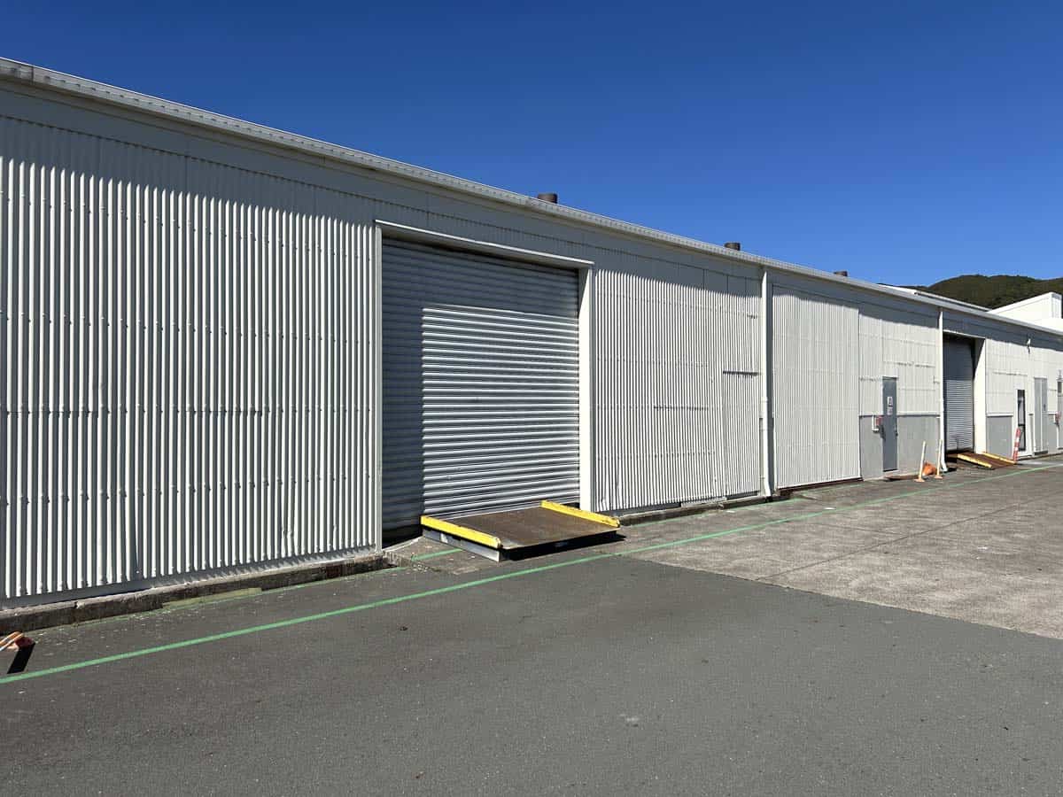 Industrial warehouse with roller door at 42 Seaview Road, White Lion, New Zealand.