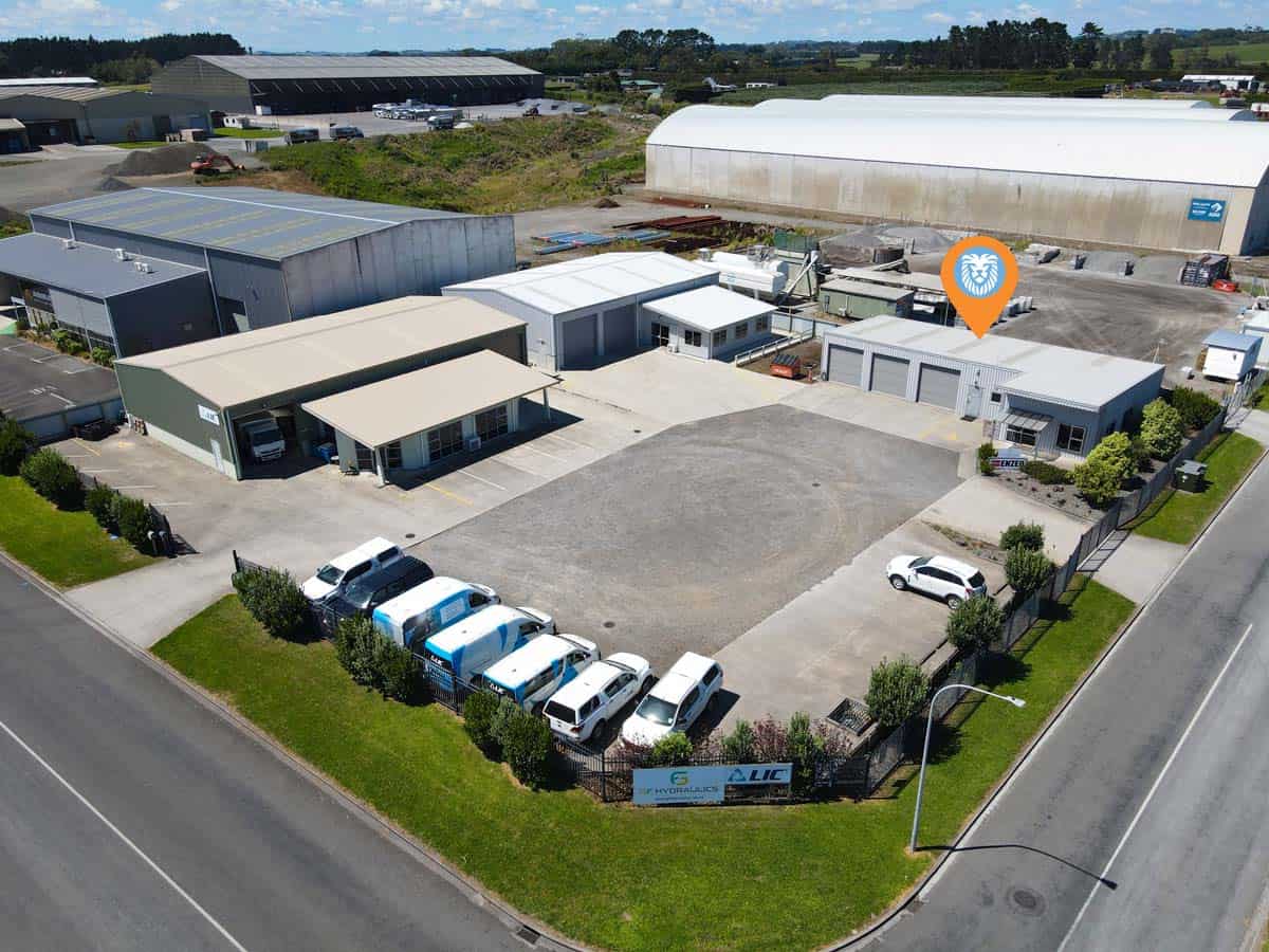 Aerial view of White Lion industrial complex at 76 De Havilland Drive, showcasing buildings and park.