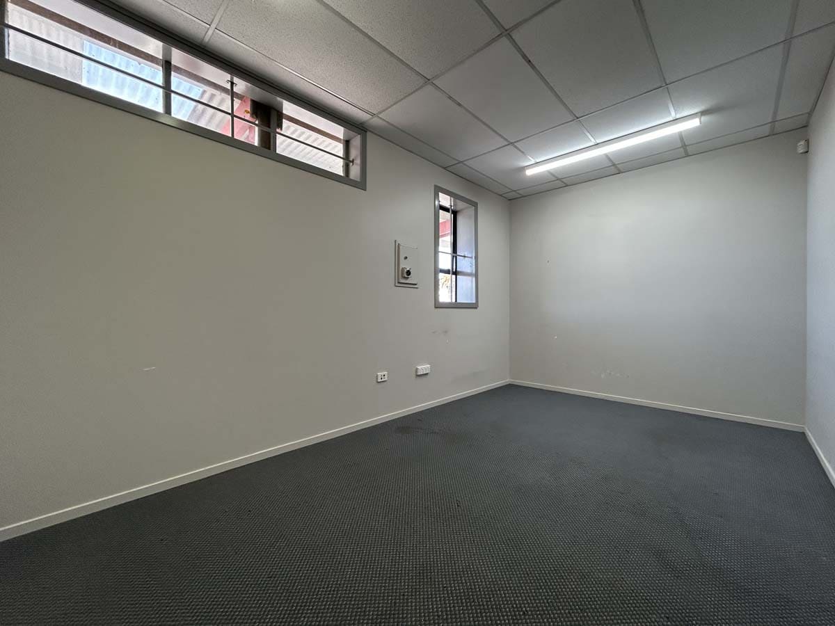 Modern office interior with natural light and neutral decor.