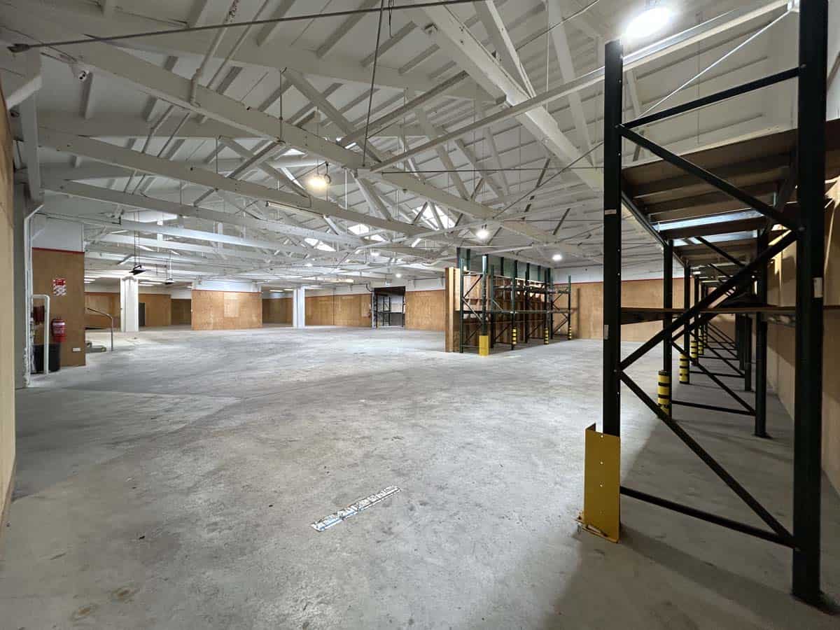 Spacious warehouse interior at 1121 Devon Road with high ceilings and storage racks.
