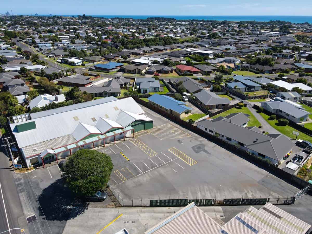 Aerial view of White Lion property at 1121 Devon Road, surrounded by residential homes.