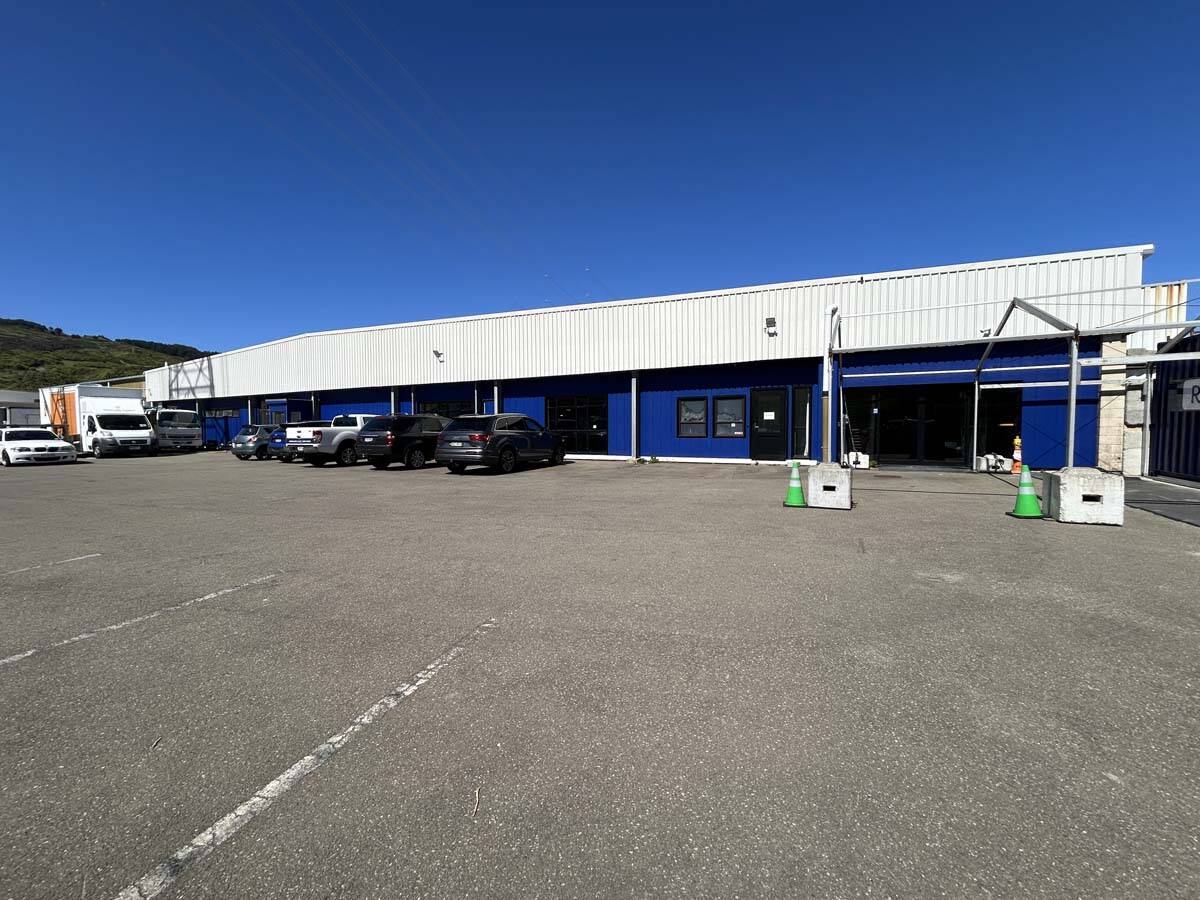 Large industrial warehouse with parking area at 25 Cashew Street.