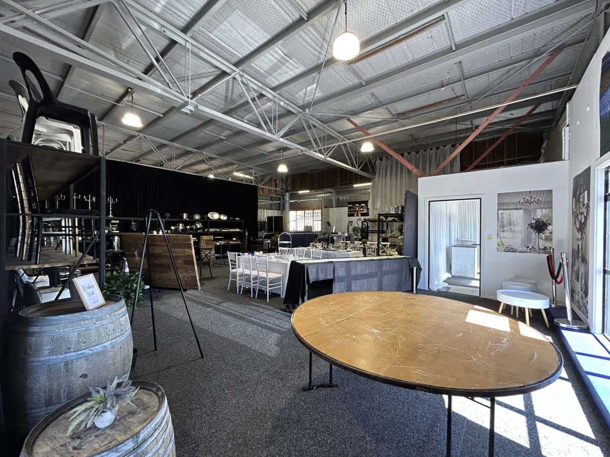 Spacious indoor event venue with tables and seating at White Lion, 25 Cashew Street.