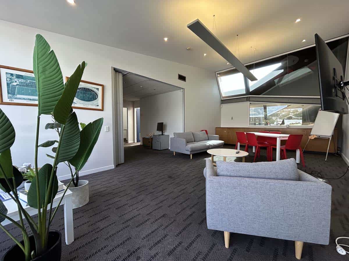 Contemporary lounge area with comfortable seating and large windows at White Lion, Level 1, 20 Johns.