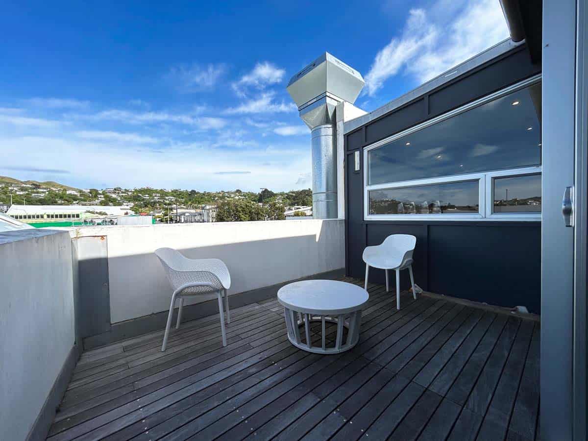 Rooftop terrace at White Lion, 20 Johnsonville Road, featuring outdoor seating and cityscape views.