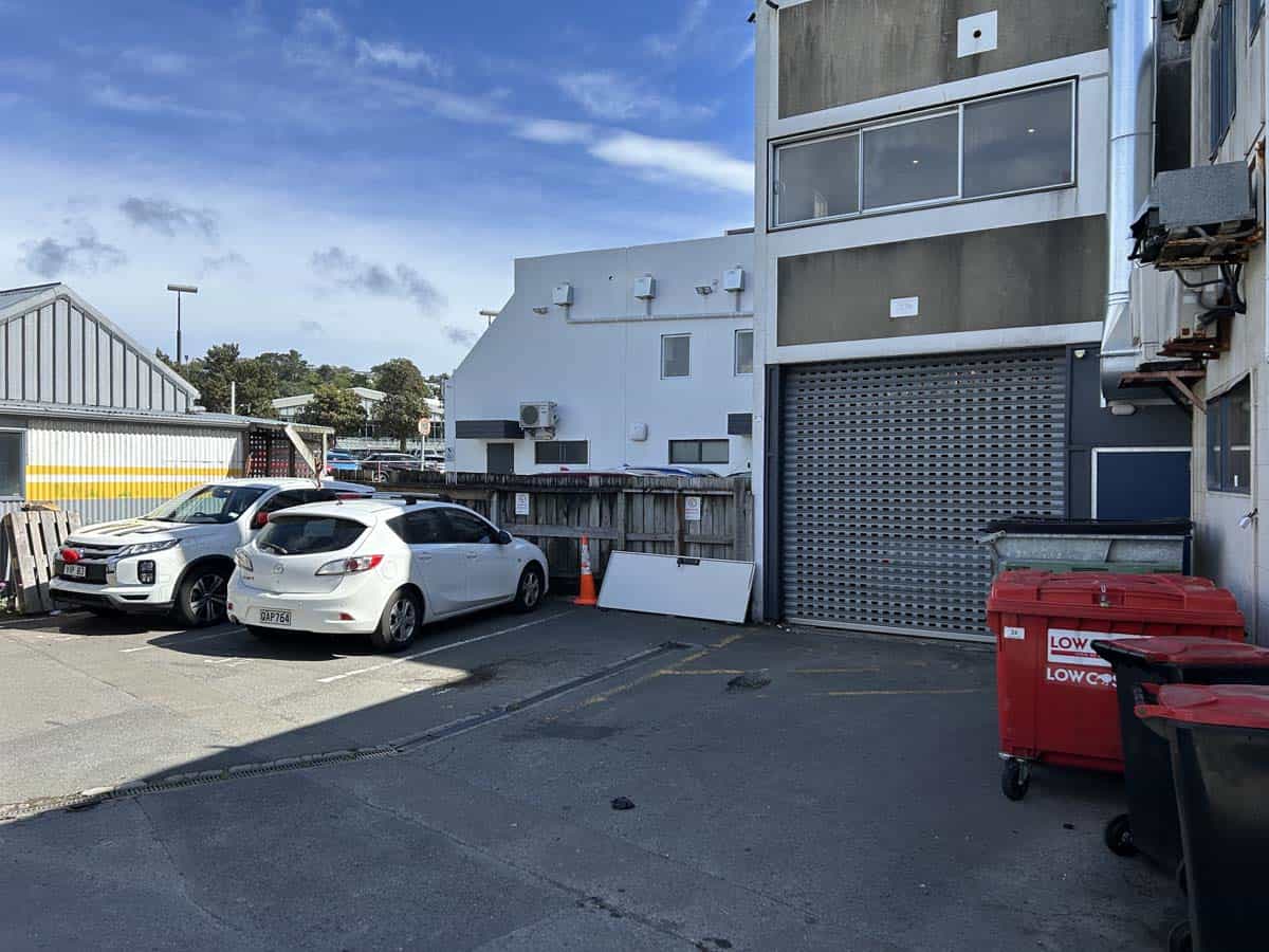 Modern commercial building at Level 1, 20 Johnsonville Road with parking area.