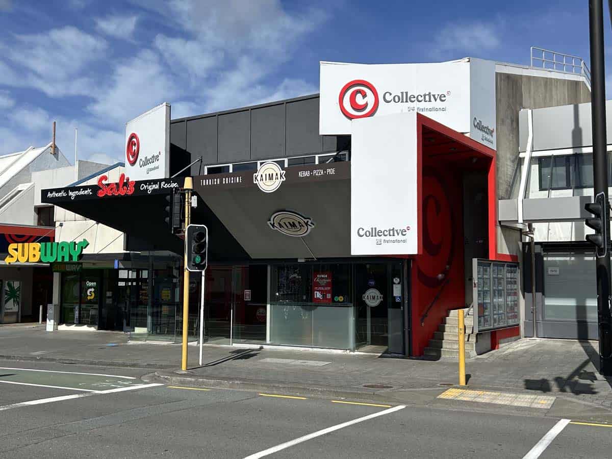 White Lion building with retail stores and signage in Johnsonville.
