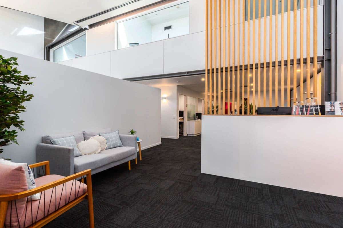 Modern office reception with stylish seating and contemporary design.