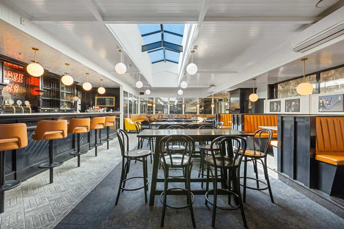 Interior of White Lion restaurant at 31 Gover Street, featuring contemporary design and seating.