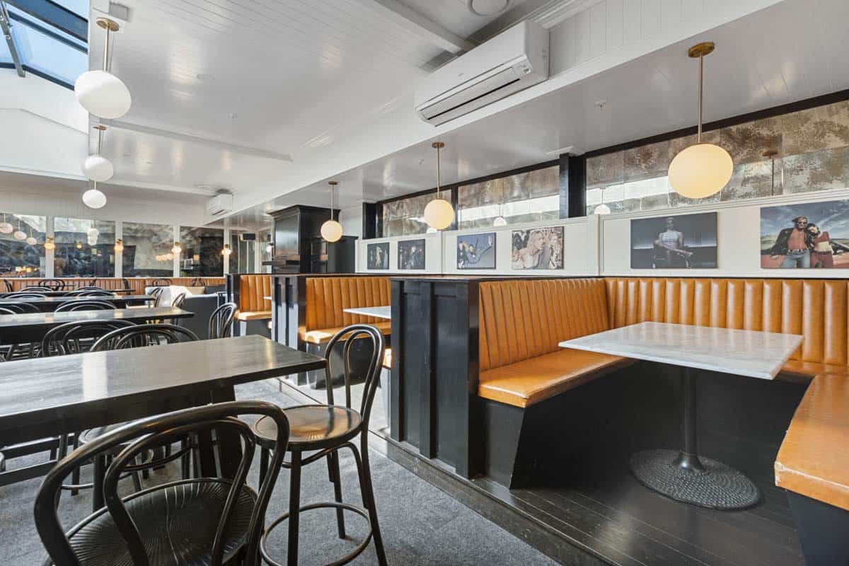 Modern dining space at White Lion with stylish seating and ambient lighting.