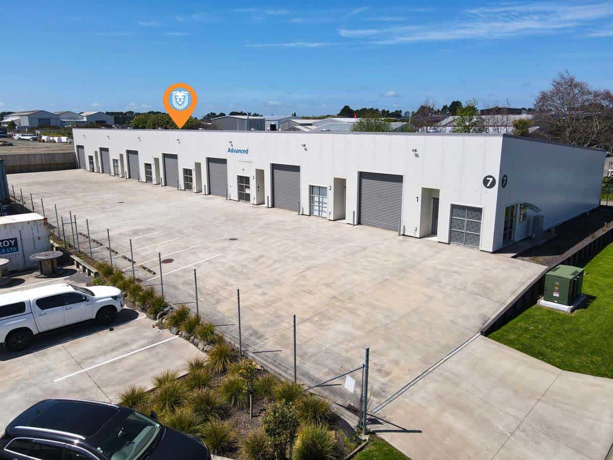 Modern industrial warehouse at 7 Hudson Road with loading bays and parking.