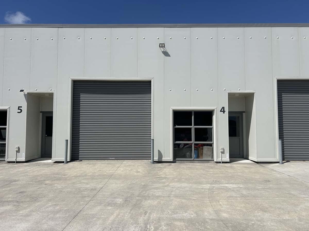 Warehouse unit 4 at 7 Hudson Road with roller door and entry doors.
