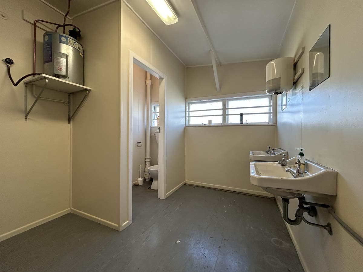 Interior view of a commercial space at 122 Hutt Road, featuring a sink and utility area.