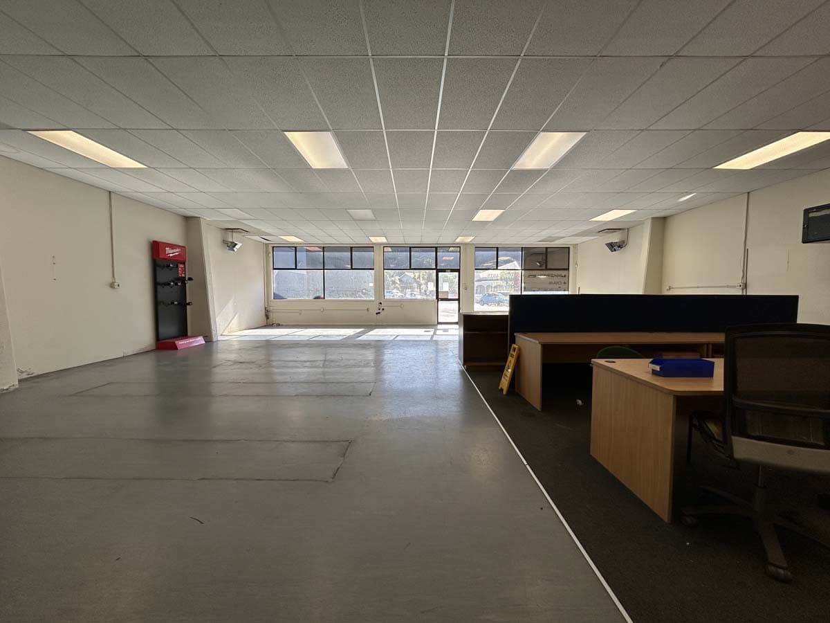 Modern office interior with desks and large windows in Wellington.
