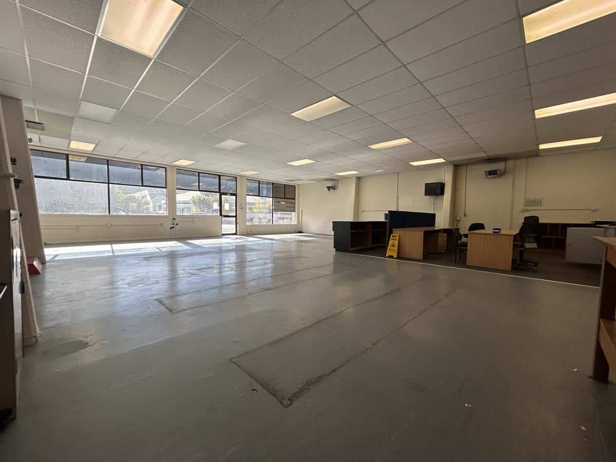 Spacious interior of White Lion commercial property with large windows and open layout.