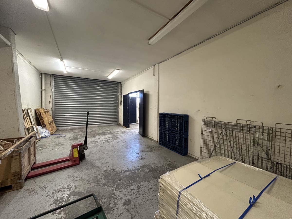 Storage space at 122 Hutt Road with industrial shelving and equipment.