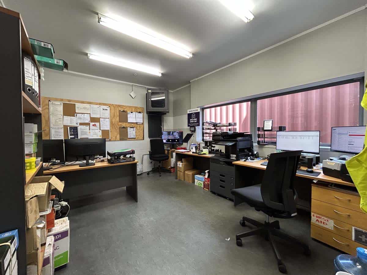 Interior view of a professional office with desks, computers, and office supplies at White Lion.