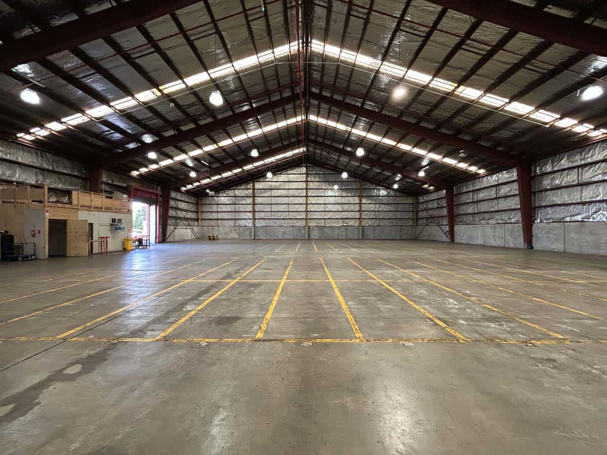 Spacious warehouse interior at 38 East Street with high ceilings and ample lighting.
