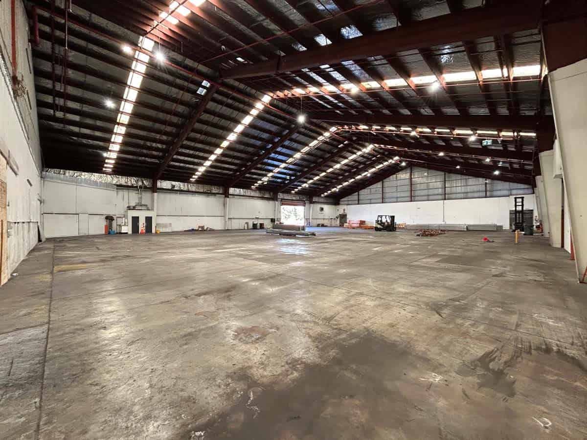 Spacious industrial warehouse at 38 East Street with high ceilings and ample lighting.