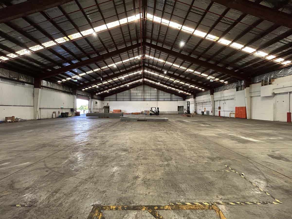 Spacious industrial warehouse with high ceilings and concrete floor at 38 East Street.