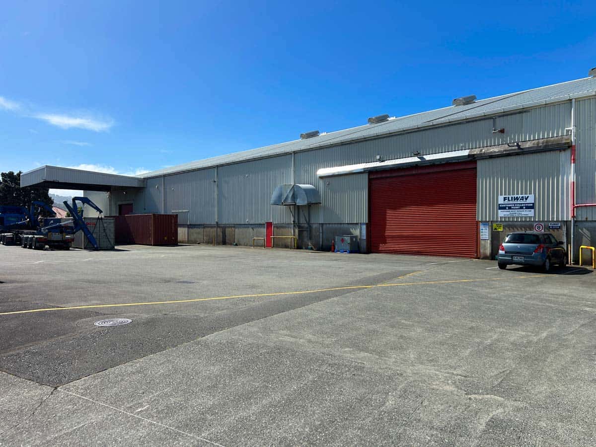 Industrial warehouse at 38 East Street with loading dock and parking area.