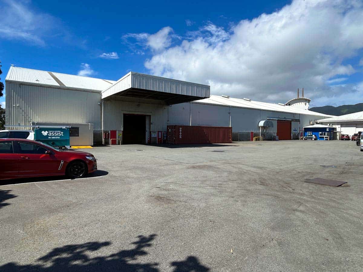 Industrial warehouse at 38 East Street with parking and trucks.