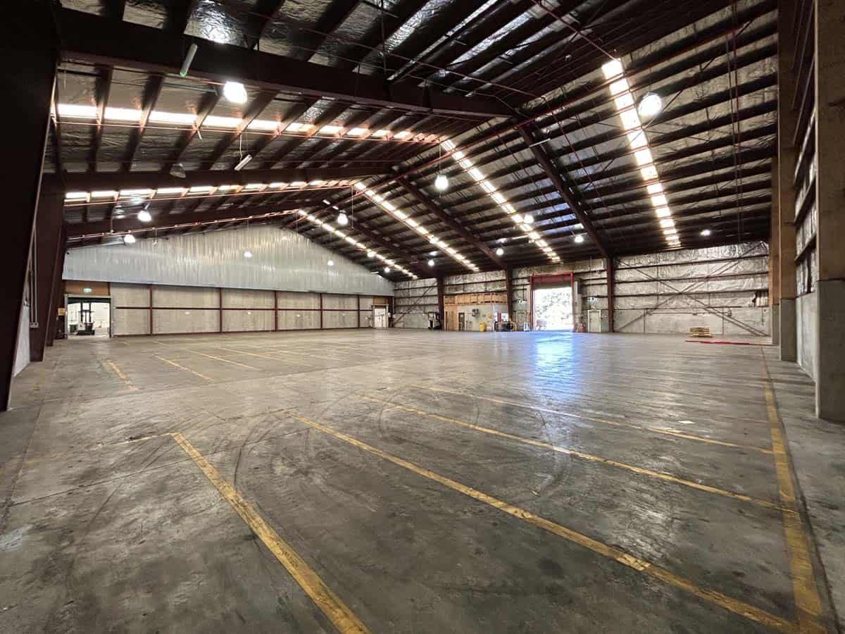 Spacious warehouse interior at White Lion, 38 East Street, with high ceilings and ample lighting.