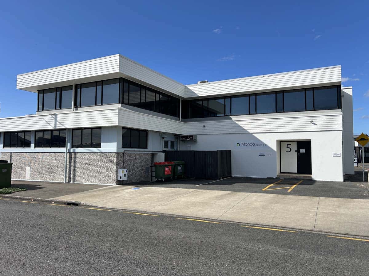 White Lion office building with sleek design and large windows.