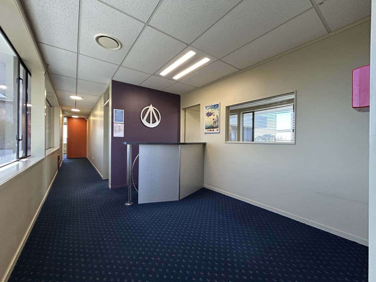 Modern office space with White Lion branding at 5 Clinton Street, featuring a reception area and win.