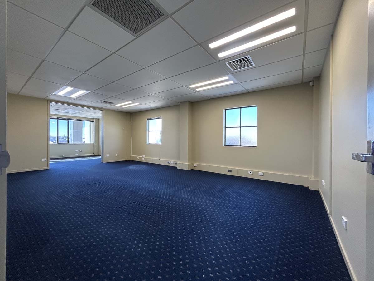 Office interior with natural light, clean design, and spacious layout.