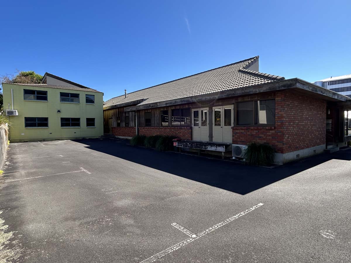 White Lion building at Powderham Business Centre with parking area.
