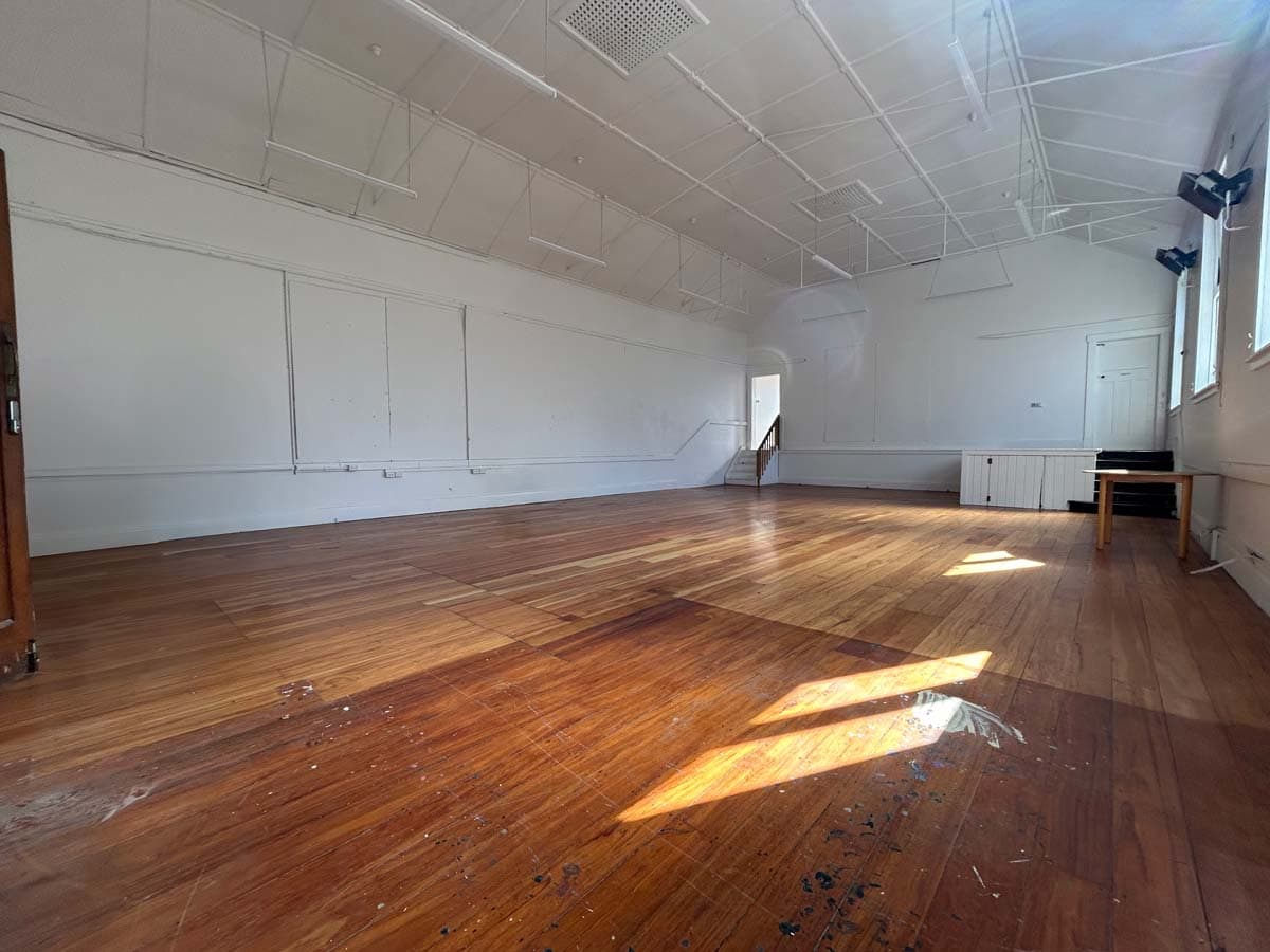 Spacious White Lion venue with wooden floors and natural light at 74 Powderham Street.