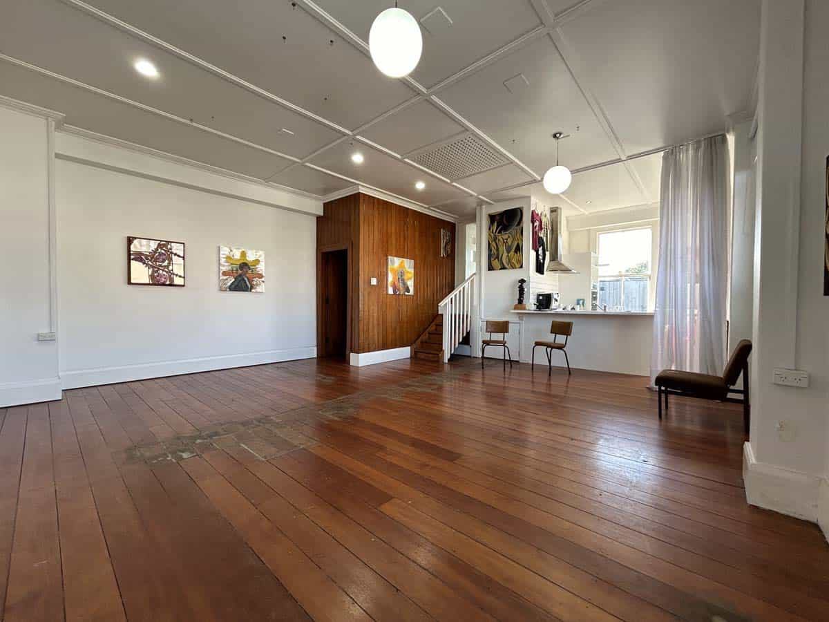 Spacious White Lion venue interior with wooden floors and modern decor.