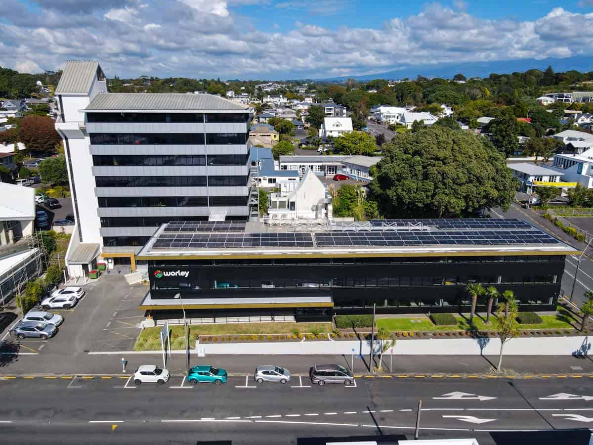 Aerial view of the White Lion office building with solar panels in a suburban area of New Zealand.