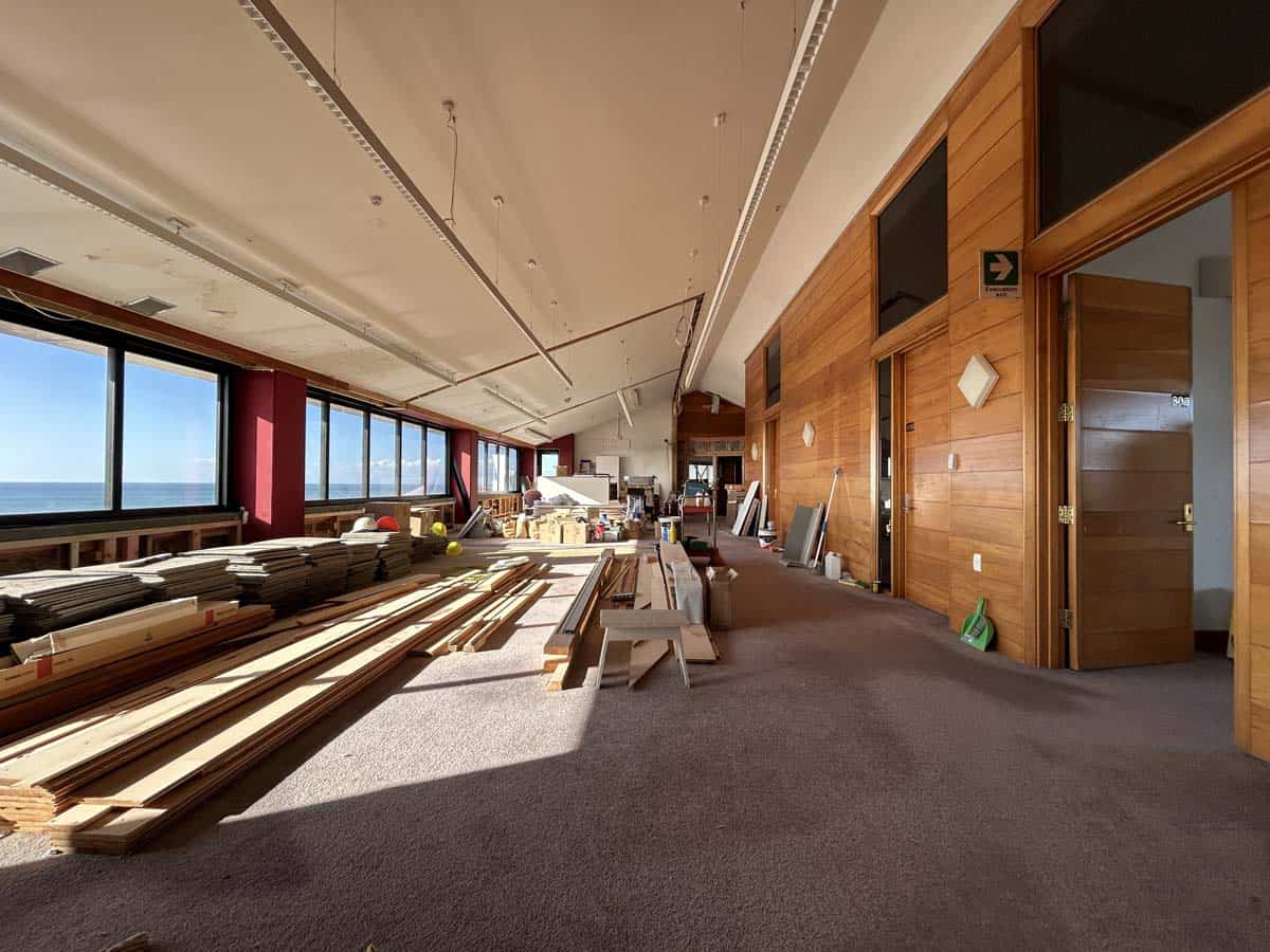 Interior of White Lion office space with construction materials and panoramic windows.