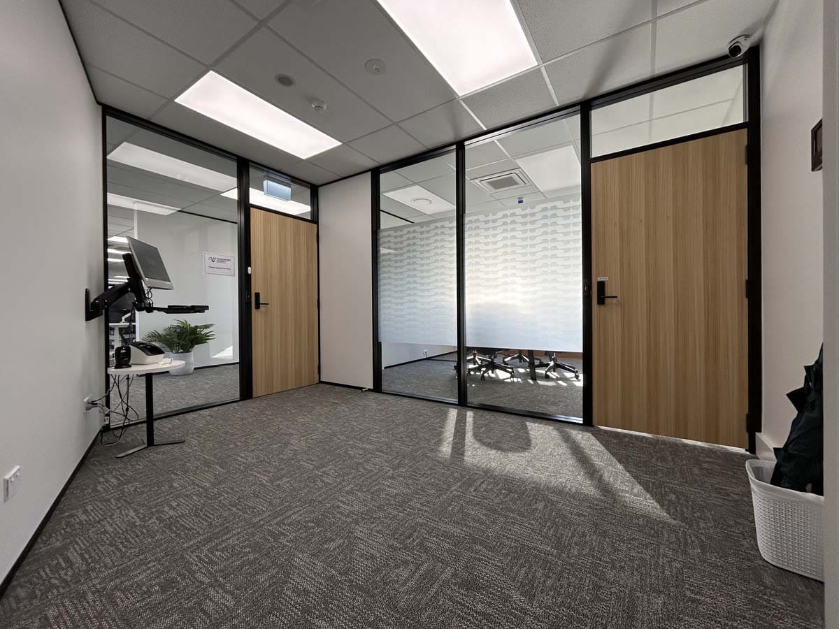 Office interior featuring glass walls and contemporary workspace at White Lion.